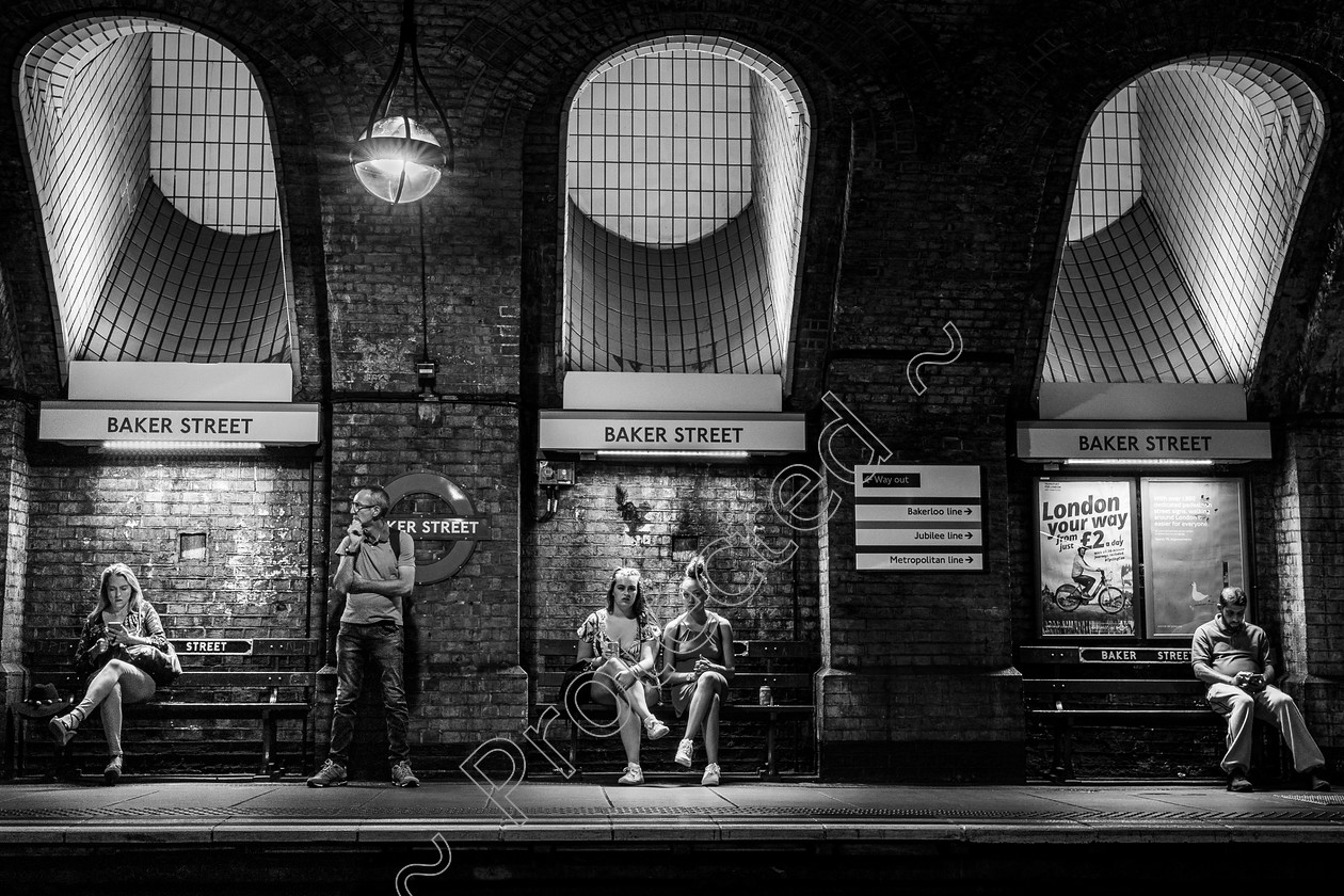 Baker-Street-Underground-PB-0012 
 Baker Street tube 20/20 in B&W competition, 2nd. Hugh Llyine analysis: The ‘charm’ of your photo Peter is that it carries both the sense of ‘placement’, but we know it’s cultural ‘self placement’ catalysed by this unique location of cubicles, seats and platform....isolations while all waiting for the next train. A great photo. 12th in APOY City Life July 2020
